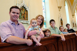 Image of DEACON PICTURED WITH FAMILY IN NEW YORK CHURCH
Deacon Dean Condon and his wife, Janet, and their children, from left, 10-month-old Daniel, 5-year-old Rachel, 13-year-old David, 10-year-old Paul, 7-year-old Timothy and 14-year-old Josh, are pictured in All Saints Church in Corning, N.Y., in early Sep tember. Deacon Condon and his large family moved into the parish rectory in July. The 44-year-old deacon had spent the previous 11 years as pastoral administrator at Guardian Angels Parish in Henrietta, N.Y. (CNS photo/Mike Crupi, Catholic Courier) 