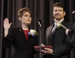Image of In this Dec. 4, 2006 file photo, Todd Palin, right, holds the Bible for his wife, Sarah Palin, as she is sworn in as Alaska's governor during an inauguration ceremony in Fairbanks, Alaska. As the political community turned desperate for any clues about the potential running mate of Republican Presidential candidate, Sen. John McCain, R-Ariz., speculation moved toward several dark horse candidates including Alaska Gov. Sarah Palin, the so-called 'hockey mom' credited with reforms of her tiny, out-of-the-way state.