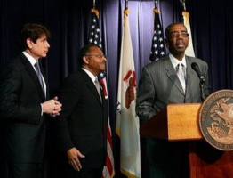 Image of US Congressman Bobby Rush (R) gives support to Former Illinois Attorney General Roland Burris (C) after Illinois Governor Rod Blagojevich (L) introduced him as his choice to fill the US Senate seat vacated by President-elect Barack Obama during a press conference at the Thompson Center in Chicago, Illinois.