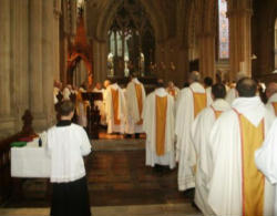 Image of Anglican and Episcopal priests of the Forward in Faith movement process into Liturgy. 