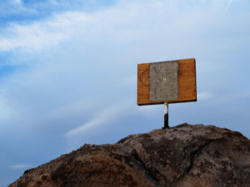 Image of The cross still stands in the Mojave National Preserve in California. However, it has been covered over with plywood. This was ordered by the Court, apparently to prevent any further such 'injuries' like what was claimed by Frank Buono.