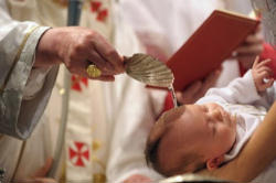 Image of (Pope Benedict Baptizing a baby) 'Be who you are' is the basic educational principle of the human person redeemed by grace.