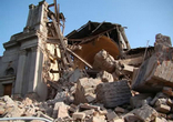 Image of A destroyed building after a huge magnitude-8.8 earthquake struck Chile early on Saturday, killing at least 700 people.
