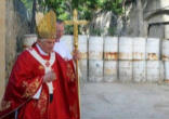 Image of Pope Benedict XVI: ' The Cross is not just a private symbol of devotion, it is not just a badge of membership of a certain group within society, and in its deepest meaning it has nothing to do with the imposition of a creed or a philosophy by force. It speaks of hope, it speaks of love, it speaks of the victory of non-violence over oppression, it speaks of God raising up the lowly, empowering the weak,conquering division, and overcoming hatred with love.'