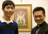 Image of Fr. Dat Hoang presenting an award.