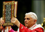 Image of Pope Benedict carries the Book of the Gospels