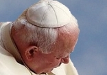 Image of John Paul II wore a white skull cap, also called a zucchetto or pileolus