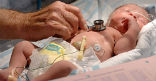 Image of U.S. infant mortality has improved, but slowly. The U.S. is now tied with Qatar. 