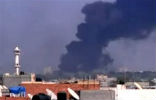 Image of Smoke rises from Gadhafi's fortified compound in Tripoli. Rebels report its capture, but fighting is still reported.
