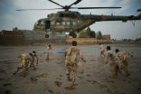 Image of The Pakistani military delivers aid to people stranded by flooding in this archive photo. 