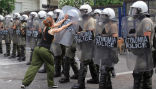 Image of A lone protester challenges the police during protests in June in this file photo.