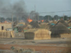 Image of A village is set alight during last week's fighting.