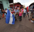 Image of A few of Ortega's followers rally in the streets.