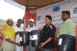 Image of Caritas Pakistan Karachi staff distribute dustbins yesterday in Saif-ul-Marri Goth.