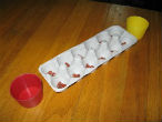 Image of Games such as mancala can be improvised using household items and can make for hours of summertime fun.