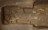 Image of The grave has yielded many artifacts, but no body.