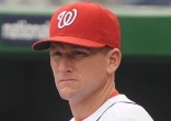 Image of Perched atop the team dugout steps, Rick Eckstein watches his hitters. (Photo courtesy of Washington Nationals)