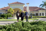 Image of Fr. Orsi walks with colleagues at the Ave Maria School of Law where he serves as a spiritual director. 