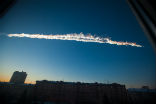 Image of The meteorite streaked a twin contrail in the sky over Chelyabinsk. 