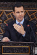 Image of Assad figuratively slaps Obama, Obama wants more evidence of it. 