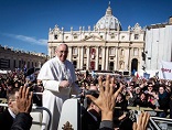 Image of Pope Francis greeting enthusiastic crowds
