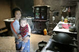 Image of Du Xiurong with her grandchild, for whom she also says she will sell everything to ensure he has a good education. 