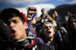 Image of Young protesters come out to rally against high unemployment and government cuts. 