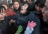 Image of Lili Zeng (pictured) was forcibly aborted by agents of the State. The nine month old child in her womb was given a lethal injection in the  skull. The little one survived to birth and died in the arms of a mother.  

