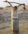 Image of An unidentified man is crucified by Muslim extremists after being accused of spying for the US.