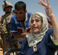 Image of One of the eleven elderly Iraqi Christians who refused to convert to Islam, even after threats of beheading, now safe inside a refugee camp in Kurdish controlled territory.