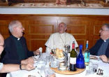 Image of Pope Francis share a laugh with fellow Priests.