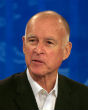 Image of California's governor Jerry Brown signed a bill that grants hourly employees paid sick leave. The bill will come into effect in July of 2015.