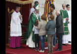 Image of Pope Francis with family during Mass.