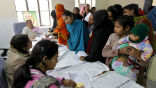 Image of Indian women wait to sign up for sterilization, a program run by the government to help control the billion plus population.