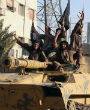 Image of Members of the Islamic State in a captured tank.
