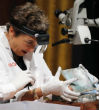 Image of Pam Hatchfield, head of objects conservation for Boston's Museum of Fine Arts, is seen opening the time capsule with complete awe. 