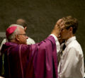 Pictured. A Bishop placing ashes on the head of a penitent on Ash Wednesday Image of Pictured. A Bishop placing ashes on the head of a penitent on Ash Wednesday