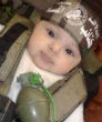 Image of ISIS has posted many pictures of babies dressed in ISIS garb with weapons.