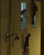 Image of An unnamed pregnant woman hung on the ledge of a window and was saved from falling to her death (Daniel PSenny/Le Monde).
