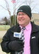 Image of News reporter stops mid-broadcast to call 911 on bank robber suspect (YouTube).