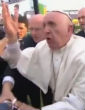 Image of Pope Francis was overpowered by the crowd, forcing him to stumble over man in wheelchair (YouTube).