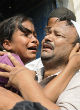 Image of The girl's sister was inconsolable during the funeral (AFP/Getty Images).