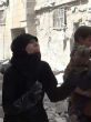 Image of Syrian mother grieves for her daughter, who was killed during an air strike in Aleppo (barry Newsa/YouTube).