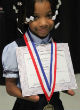 Image of Anaya Ellick won an award for having the best handwriting despite not having hands (Facebook).
