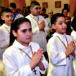 Image of Iraqi refugee children make First Communion (NCRegister).
