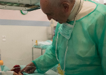 Image of Pope Francis with infant.