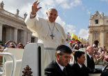 Image of Pope Francis names seven new saints.