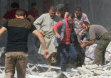 Image of Syrians inspect damage and search for survivors following Russian airstrikes (Anadolu).