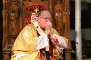 Cardinal Dolan should do more to ensure donations fit the Church's needs, such as maintaining schools across the Archdiocese. The people also have an obligation to support their Church, and priests and bishops deserve breaks. Dialogue all around may improve the situation for the Archdiocese.