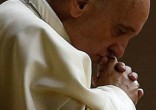 Image of Pope Francis prays for Iraq as the innocents' death toll rises.